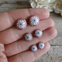 Coral stud earrings with flower design