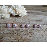 Coral stud earrings with flower design